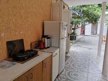 Фото номера Четырехместный номер с балконом Гостевой дом Asida Guest House г. Сухум 2