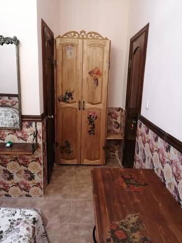 Фото номера Двухместный номер с 2 отдельными кроватями и ванной комнатой Гостевой дом Магнолия г. Сухум 4