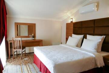 Фото номера Семейный номер Отель Garuda Boutique Hotel г. Сухум 3